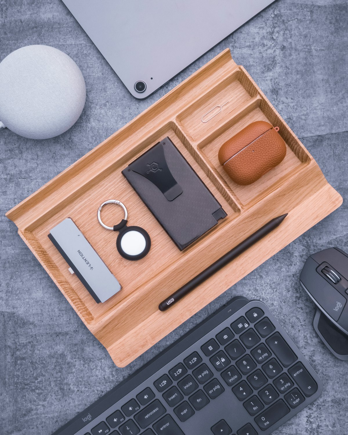 A wooden tray with small desk things