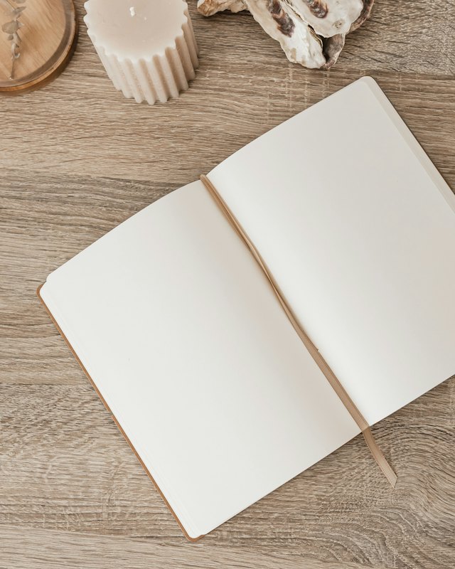 An open notebook on a wooden table