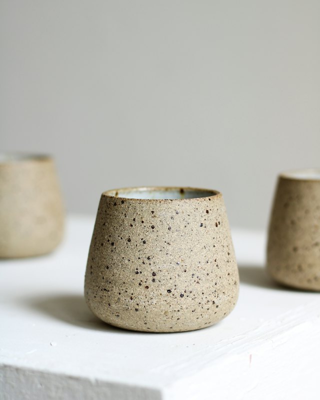 A speckled stoneware cup
