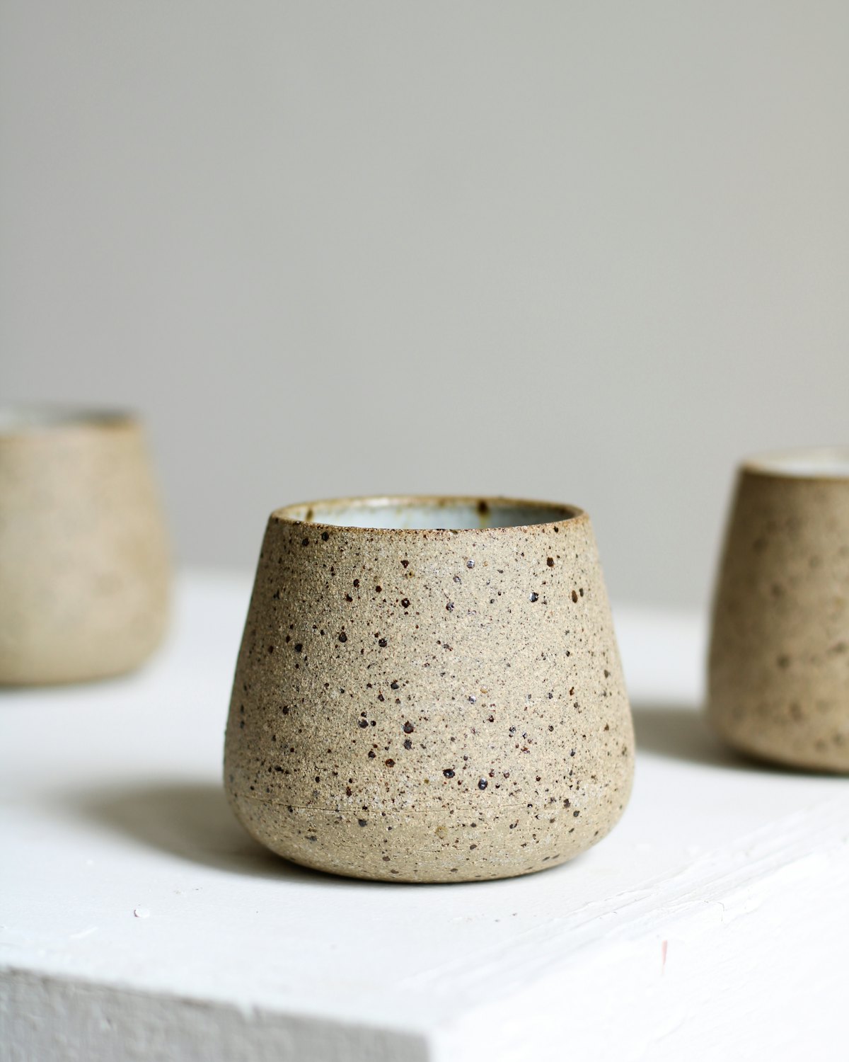 A speckled stoneware cup